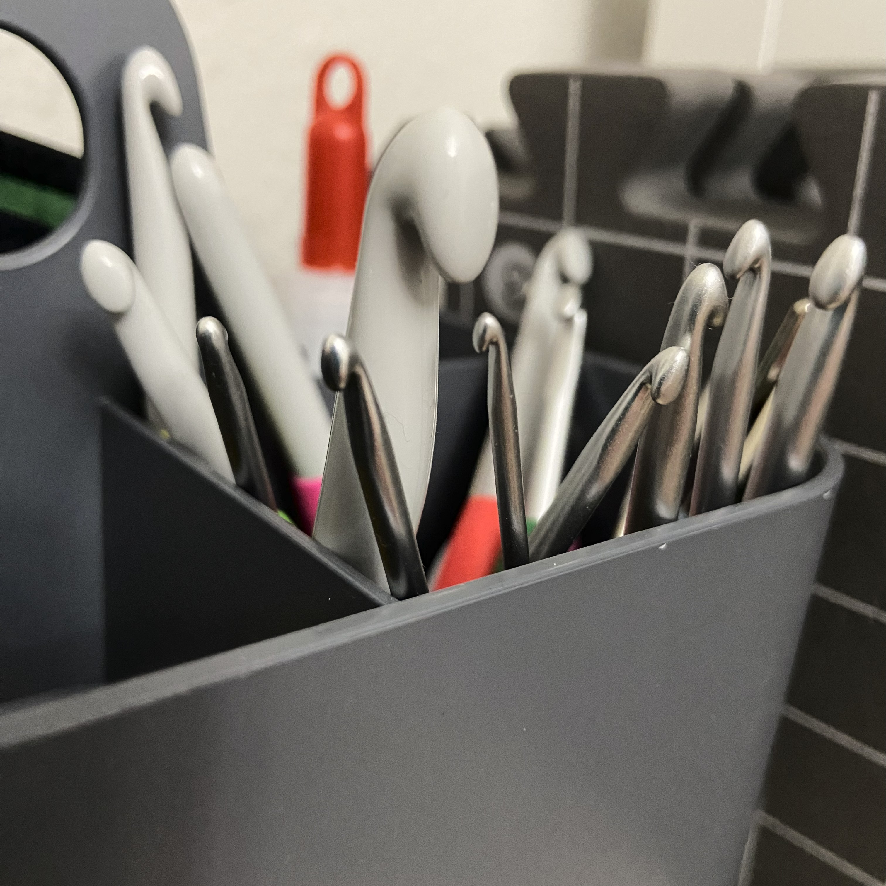 caddy filled with crochet hooks